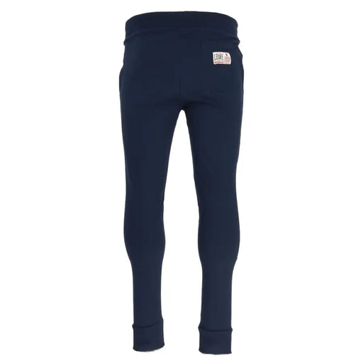 Navy blue cotton sweatpants shown from the back with a white label on the waistband for casual wear