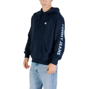 Navy blue Tommy Jeans hoodie displayed, stylish and comfortable casual wear