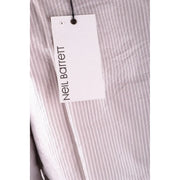 Neil barrett branded tag attached to a light grey cotton vertically striped shirt fabric