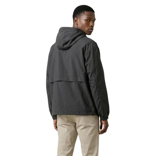 New Balance men blazer black nylon hooded zip jacket with dark gray sleek design and subtle seam detailing