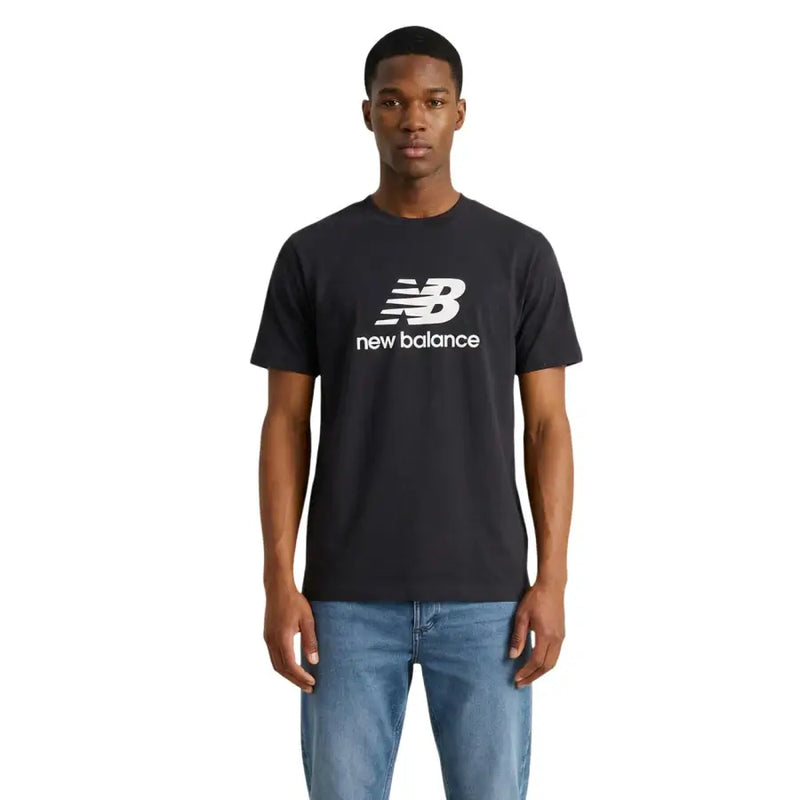 Black new balance men t-shirt featuring a white logo and text across the chest for casual wear