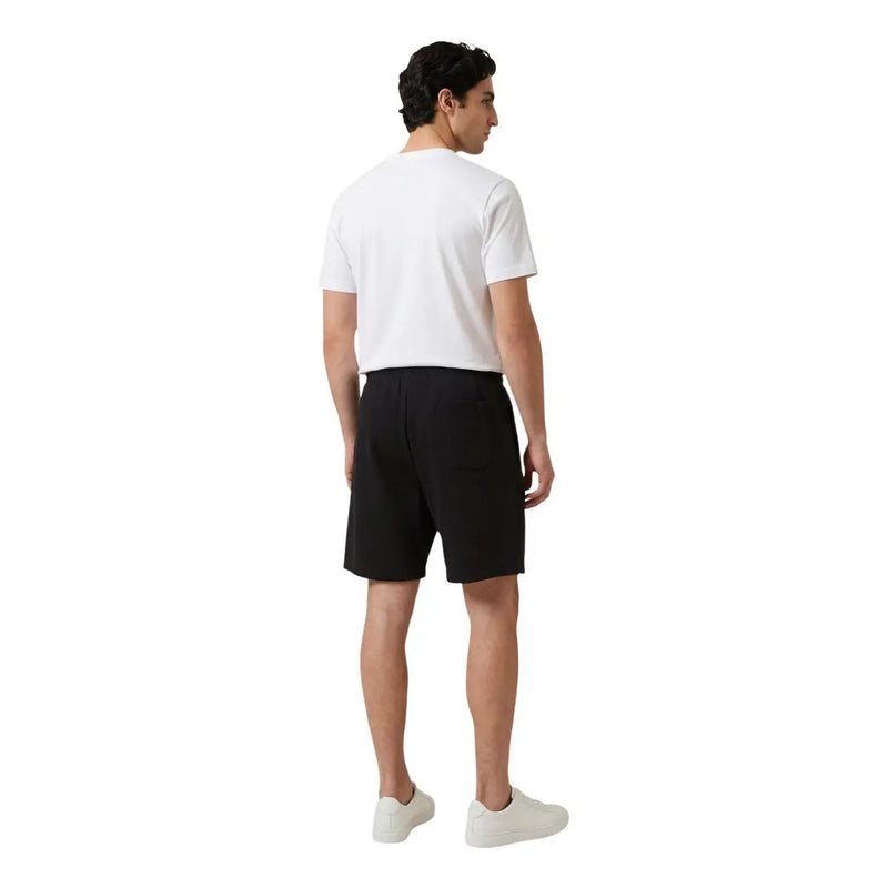 Black tailored shorts with a clean minimalist design featured in new balance men t-shirt product collection