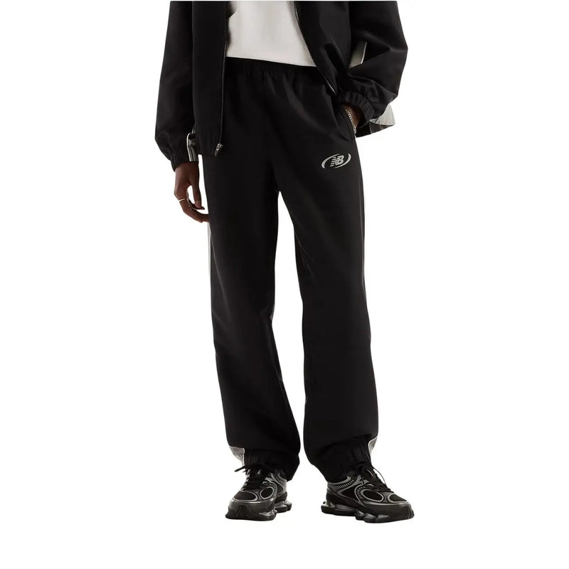 New Balance men trousers black polyester fall winter joggers with subtle white logo and gray trim at the cuffs