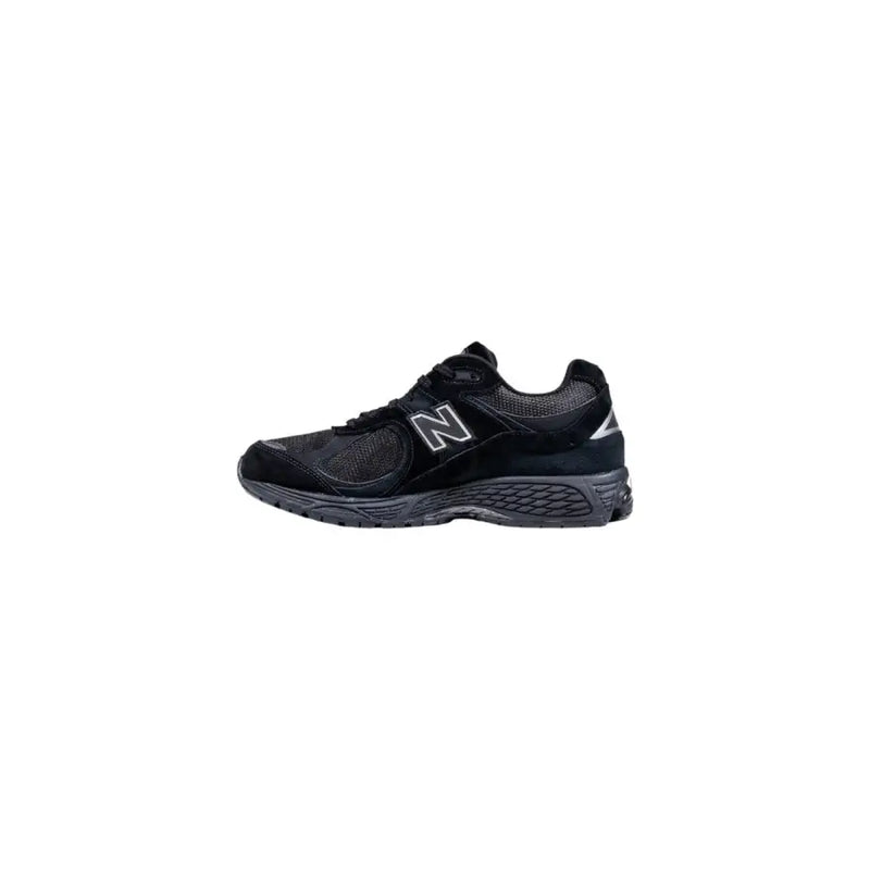 Black new balance athletic shoe with white accents and textured sole design.