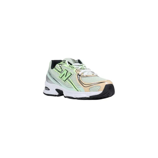 Neon green and white new balance running shoe with mesh upper, rubber sole.