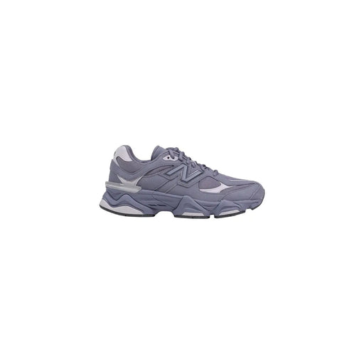 New balance women grey suede sneaker with chunky layered sole and subtle white accents for casual wear