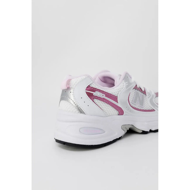 New Balance women pink synthetic sneakers with white and pink mesh upper silver accents and cushioned sole
