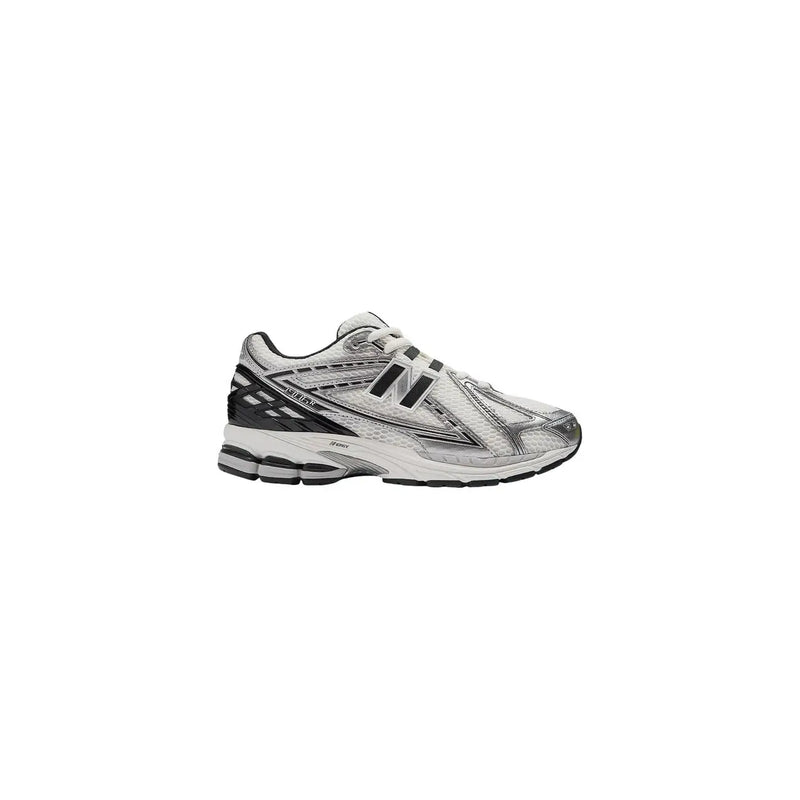 New Balance women silver slip on skate sneakers with black mesh upper and rubber sole designed for casual wear