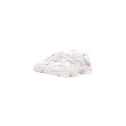 New Balance women suede sneakers lilac leather featuring white and pale lavender colors with a chunky layered sole design