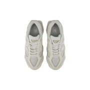 A pair of off-white new balance women white synthetic sneakers with mesh overlays and a chunky retro midsole design