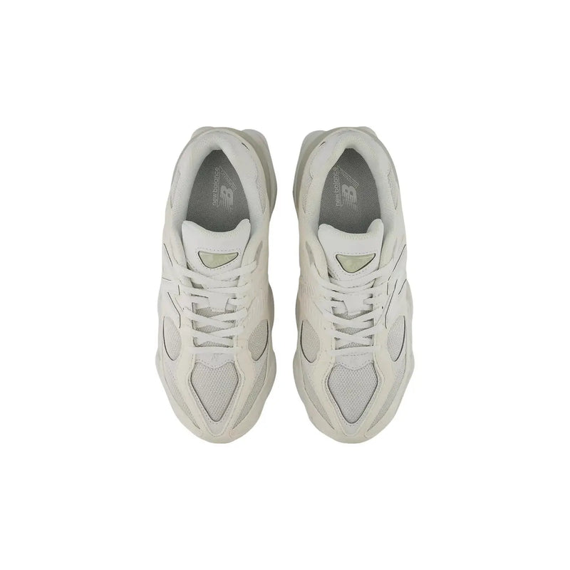 A pair of off-white new balance women white synthetic sneakers with mesh overlays and a chunky retro midsole design