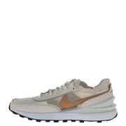 Nike women’s pink slip-on sneakers in beige and tan with layered materials, translucent panel, and chunky white midsole