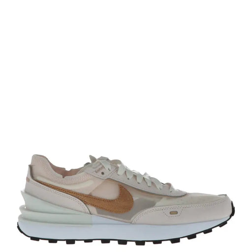 Nike women’s pink slip-on sneakers featuring beige and gold waffle runner design with suede overlays and chunky white midsole