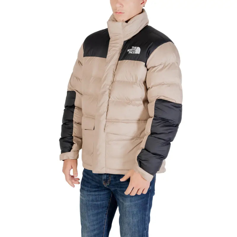 Beige and black north face puffer jacket with a classic design.