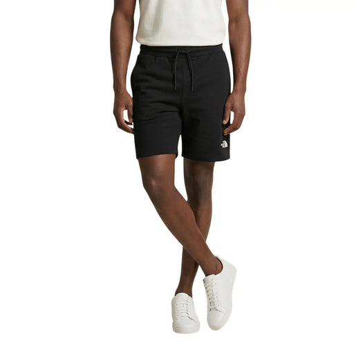 The North Face cotton shorts for men in black with drawstring waistband and white logo on lower leg front view