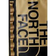 The north face men beige print rucksack with gold color black lettering and wavy gold trim along the side