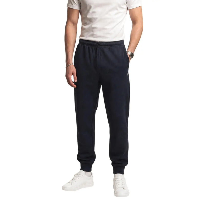 The north face men black cotton fleece jogger trousers in navy blue with elastic waistband and ribbed cuffs