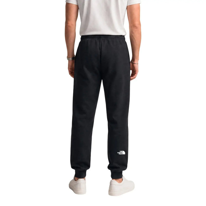 Black the north face men cotton fleece joggers with a white logo on the lower left leg