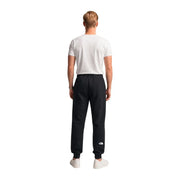 The North Face men black cotton fleece trousers feature a white logo on the lower left leg in jogger style