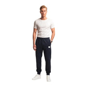 The north face men black cotton fleece trousers in navy blue feature a white logo patch and elastic cuffs
