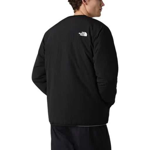 Black the north face men blazer nylon jacket with white logo on the back side featuring a zip closure