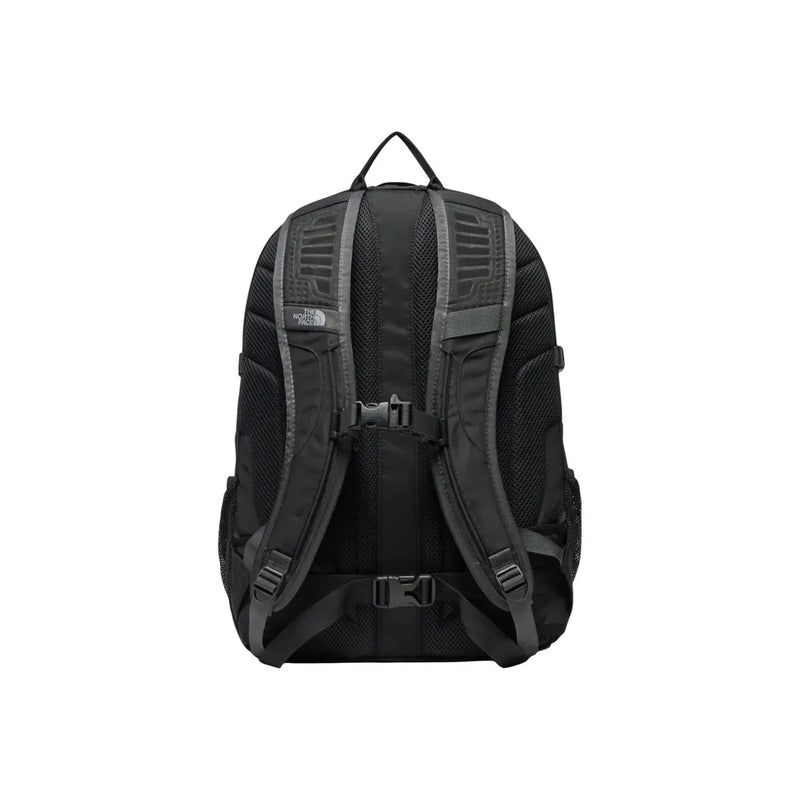The north face men borealis classic black nylon backpack with gray mesh and reinforced straps shown from the back side