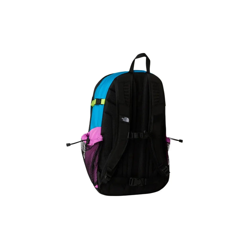 The north face men hot shot SE purple nylon rucksack with black and blue body, pink mesh pockets, and neon green strap accent