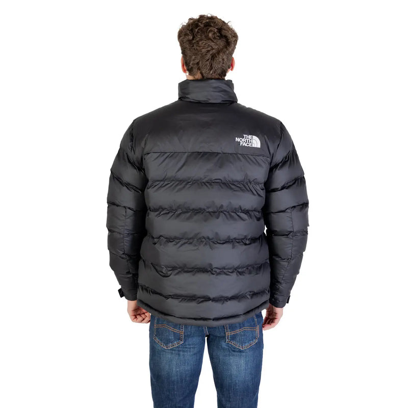 The back side of a black north face men jacket with horizontal stitching white logo polyester long turtleneck