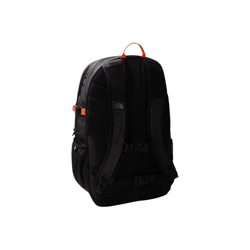 Black the north face men rucksack with grey nylon pockets and orange accents on top handle and side buckle