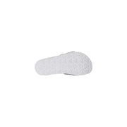 The north face men slippers with white logo print feature a white rubber sole with geometric tread and black trim