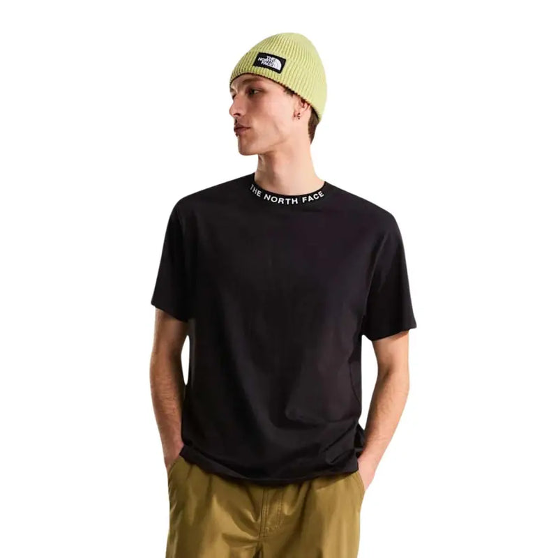 Black short-sleeved The North Face men t-shirt with branding around the collar worn by a model