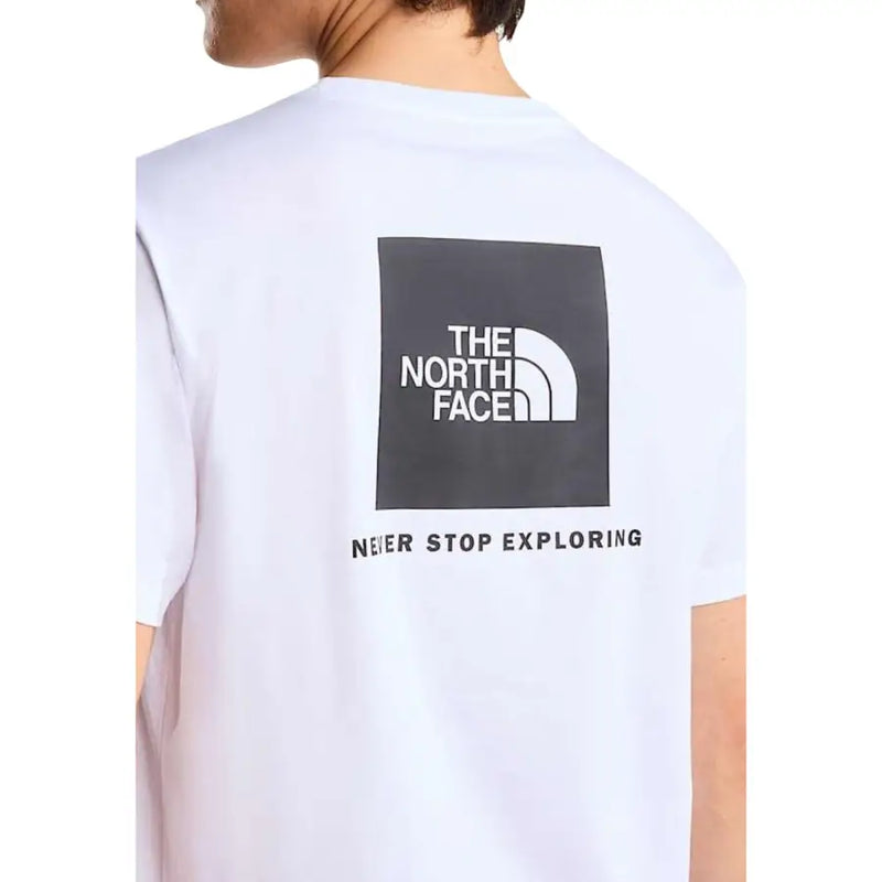 White the north face men t-shirt featuring a black square logo with half-dome symbol and never stop exploring text
