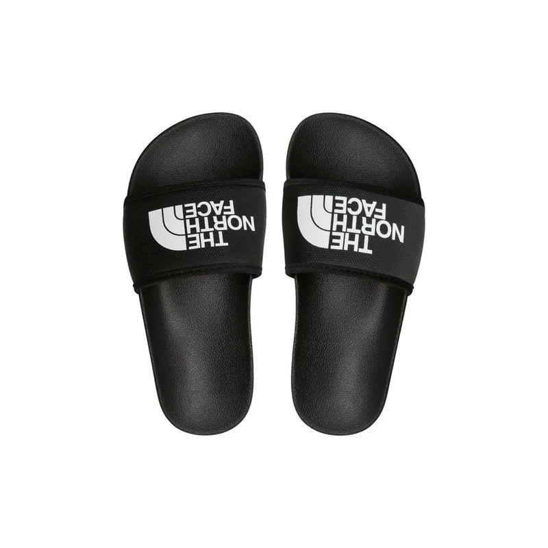 Black the north face women slip on slide slippers with white logo branding on the strap for casual wear