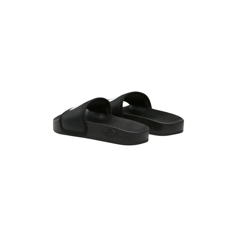 The North Face women slip on slide slippers black rubber with minimalist design and subtle white logo on the side
