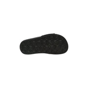 The north face women slip on slide slippers black showing the black rubber sole with geometric tread pattern