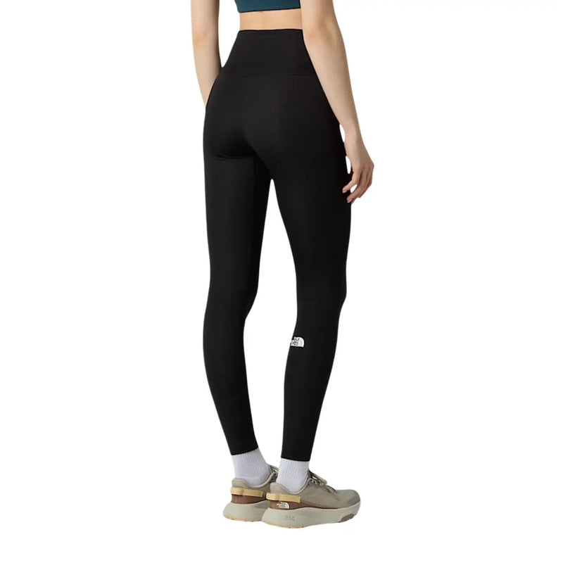 Black high-waisted leggings from the north face for women made of polyester elastane with a white logo on the left thigh