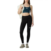 Black high-waisted leggings with white logo on left thigh made of polyester elastane by The North Face women trousers