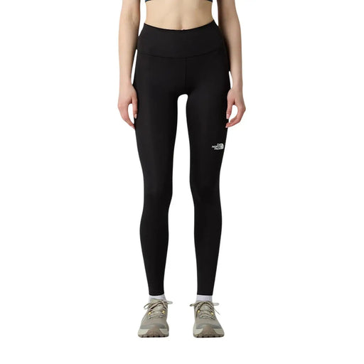 Black high-waisted The North Face women trousers made of polyester elastane with a white logo on the left thigh