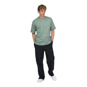 A man wearing an Only and Sons men green cotton t shirt relaxed fit with a soft muted sage green crew neck design