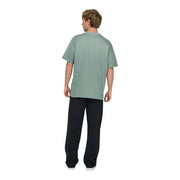 A man wearing an only and sons men green cotton t shirt with a relaxed fit and soft muted sage green color