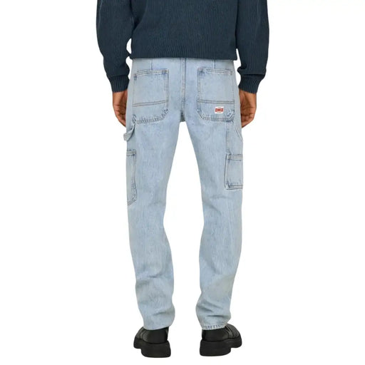 Back side of only and sons men jeans blue light-wash denim cargo pants with multiple pockets and red brand patch