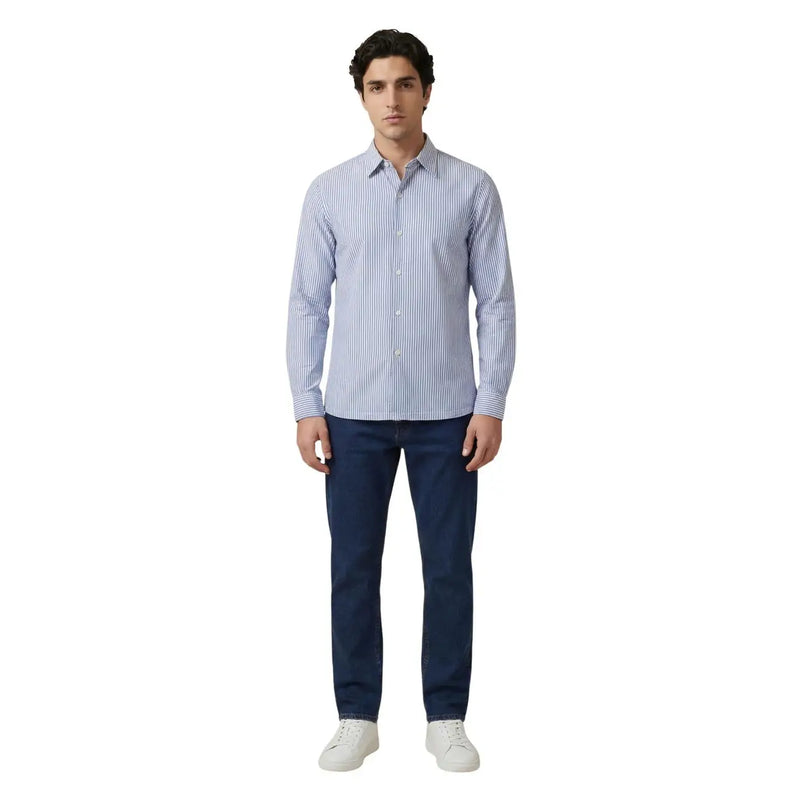 A man wearing an Only & Sons men shirt with light blue and white vertically striped long sleeves