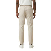 Beige cotton chino trousers with elastic waistband and two rear pockets shown from the back by Only Sons men trousers