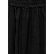 Black cotton linen skirt for women featuring an elastic waistband ideal for casual summer apparel