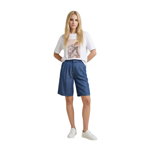 Blue denim shorts with pleated front and straight hemline paired with only women beige cotton round neck t shirt