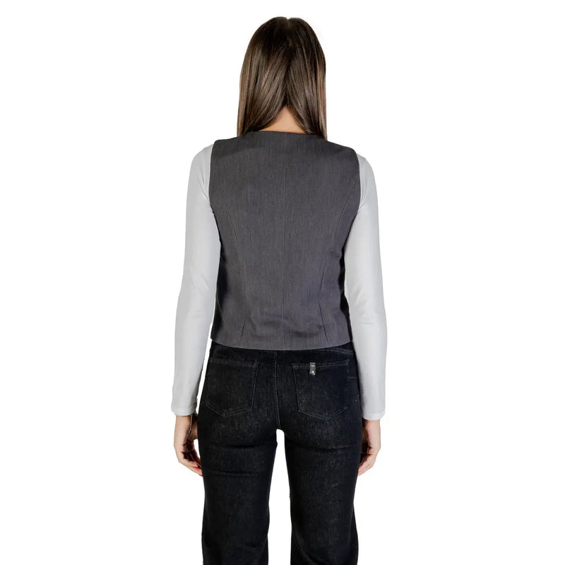 Only women grey button v neck polyester blend gilet worn over a light grey long sleeved shirt front view