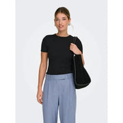 Black velvet shoulder bag with sleek minimalist design and dark trim paired with only women pink polyester t shirt