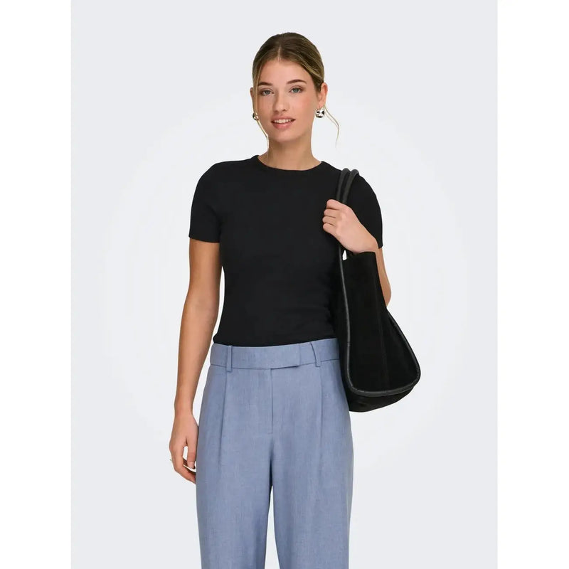 Black velvet shoulder bag with sleek minimalist design and dark trim paired with only women pink polyester t shirt
