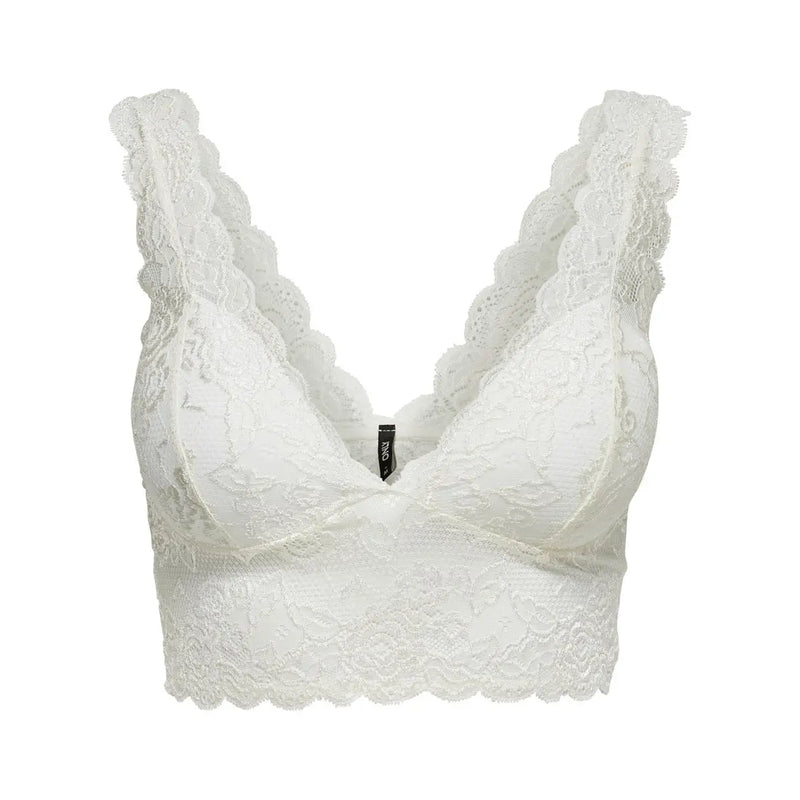 White lace bra with delicate floral patterns and scalloped edges paired with only women sleeveless v neck black polyester top