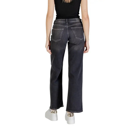 Back side view of only women spring summer black cotton elastane dark-wash denim jeans with straight-leg cut and classic pockets